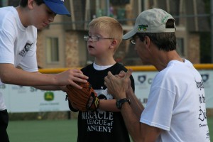 Special Needs Young Boy with Baseball Mitt